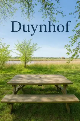 a wooden picnic table in a field with the word divide at Duynhof nabij Strand, duinen, bos en stad - 5 personen in Warmenhuizen