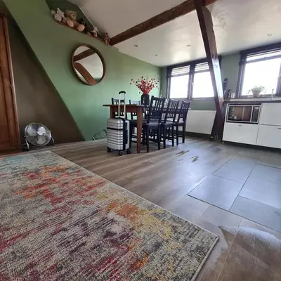 a kitchen and dining room with a table and chairs at Park 43 in Haarlem