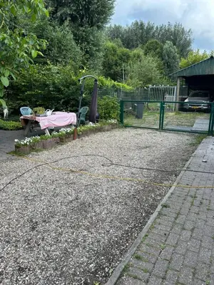 a park with a pink playground with a fence at Vlinder 2pers studio in Utrecht