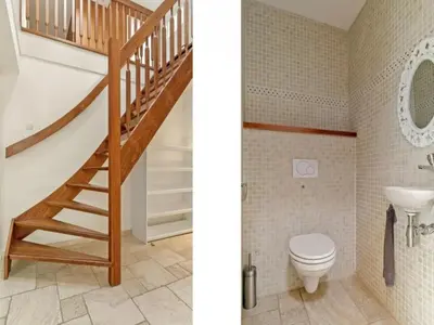 a bathroom with a staircase and a toilet at Villa in Bosrijk near Horsterwold Forest in Zeewolde
