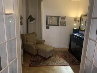 a living room with a chair and a desk at Luxury apartment in the pijp near the Rai in Amsterdam