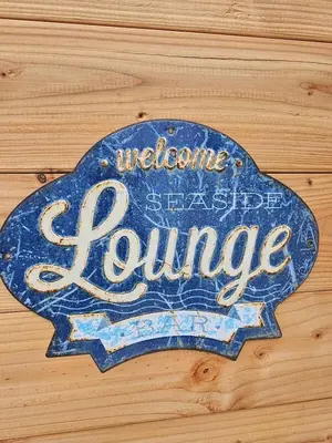 a sign that says welcome to a suspected pantomime at Sandy beach 34 in Noordwijk