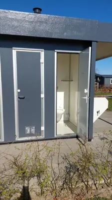 a bathroom with a toilet inside of a building at Recreatie aan de Vecht, Hooibergje 3, Weesp in Weesp