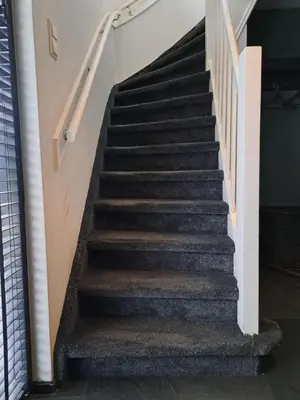 a set of stairs in a building at Ruime woning met jacuzzi, 10 min van strand in Lisse