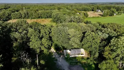 an aerial view of a house in the middle of a forest at Behouden Huis in Ons Belang