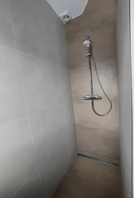 a shower in a bathroom with a shower head at Comfort Apartment Hoofddorp near Amsterdam Schiphol in Hoofddorp