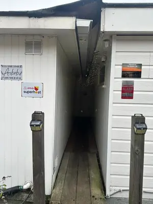 a hallway of a garage with a sign on it at woonboot de dobber loosdrechtse plassen 4-8 personen in Loosdrecht