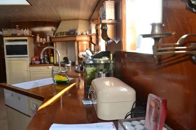 a kitchen with a counter with a mixer on it at art deco houseboat on super location in Amsterdam