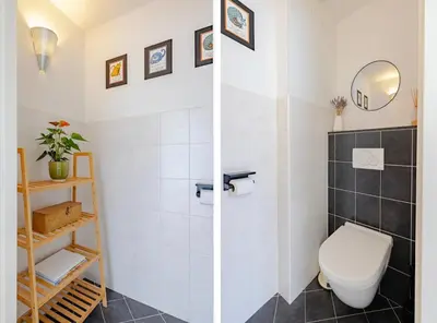 a bathroom with a toilet and a shower at Family home in Haarlem with garden, near beach & Amsterdam in Haarlem