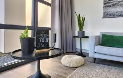 a living room with a coffee table and a chair at Gorgeous Home In Nijkerk With Wifi in Nijkerk