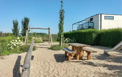 a park with a picnic table and a playground at Gorgeous Home In Nijkerk With Wifi in Nijkerk