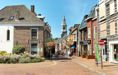 a street in an old town with a tower at Gorgeous Home In Nijkerk With Wifi in Nijkerk