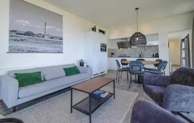 a living room with a couch and a table at Gorgeous Home In Nijkerk With Wifi in Nijkerk