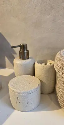 a group of three soap dispensers sitting on a counter at Studio 21 stylish and luxurious apartment in Noordwijk