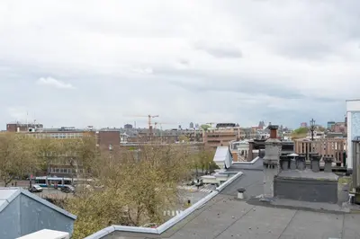 a view of a city from the roof of a building at Central HotSpot Apartment in Amsterdam