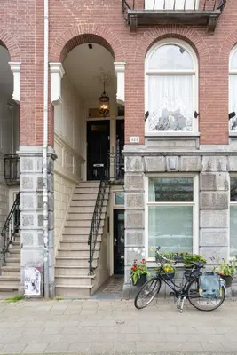 a bike parked in front of a building at Central HotSpot Apartment in Amsterdam