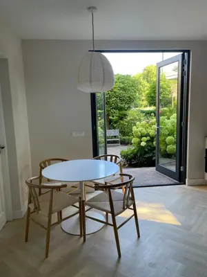 a dining room with a table and two chairs at Haarlems Huisje in Haarlem