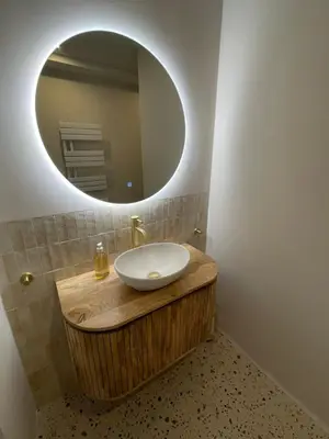 a bathroom with a sink and a mirror at Haarlems Huisje in Haarlem