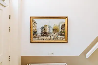 a painting of buildings on a wall at Staal House in Amsterdam
