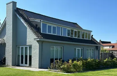a house with a black roof at Mereveld Studios in Utrecht