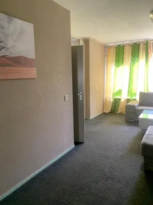 a living room with a couch and a window at Connected comfort in Amsterdam