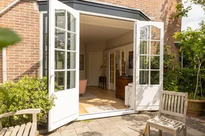 an open door to a garage in a house at Zandhuys in Zandvoort