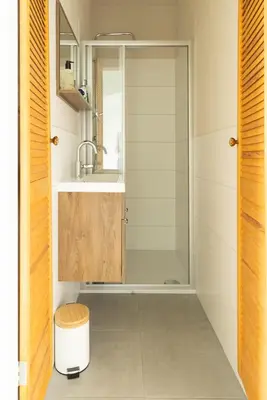 a bathroom with a shower and a sink at Zandhuys in Zandvoort