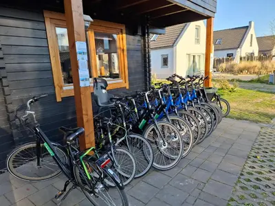 a row of bikes parked on the side of a building at Ankes Traumhaus in Sint Maarten