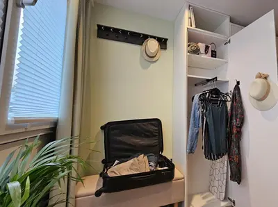a suitcase sitting on a shelf in a walk in closet at Studio Spring - 20 min from Amsterdam Centre - FREE parking in Purmerend