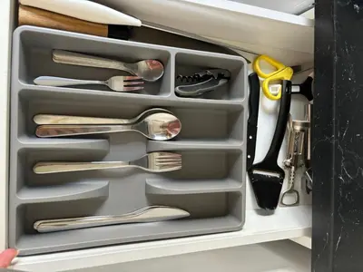 a drawer with forks and spoons and utensils at Tiny House - Surfers Paradise in Noordwijk