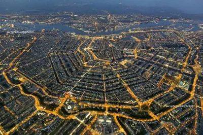 an aerial view of a city at night at Hemhuisje in Zaandam