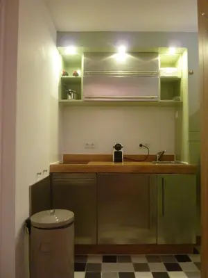 a small kitchen with a sink and a toilet at B&B BLoom in Amsterdam