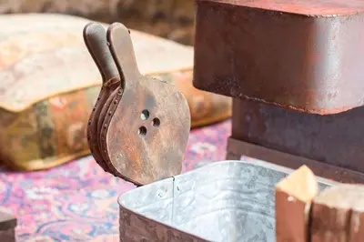a metal tool sitting in a container on a table at Reijgershof - Yurt Experience with garden view in Amsterdam