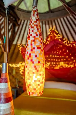 a pair of colorful vases sitting on a table at Reijgershof - Yurt Experience with garden view in Amsterdam