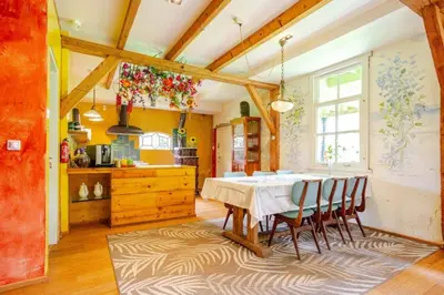 a kitchen with a table and chairs in a room at Reijgershof - Bali Suite with private terrace in Amsterdam