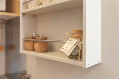 a cupboard with bread and other items on it at Guesthouse De Drukkerij in Zandvoort