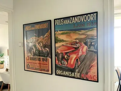 three posters hanging on a wall in a room at Nicky's Seaview in Zandvoort
