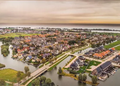an aerial view of a town on the water at B&B Het Boompje in Wervershoof