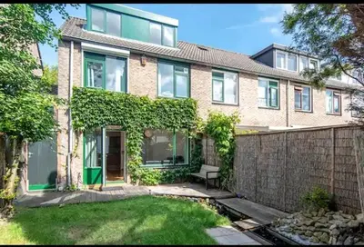 an exterior view of a brick house at Villa with garden near Amsterdam in Almere