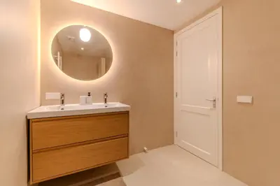 a bathroom with a sink and a mirror at City & Trainhouse in Alkmaar