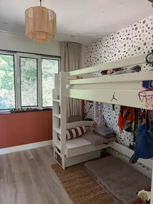 a bedroom with two bunk beds in a room at Family home Amsterdam Zuid - South in Amsterdam