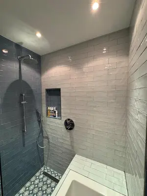 a bathroom with a shower with a tub and a sink at Family home Amsterdam Zuid - South in Amsterdam