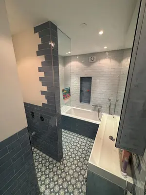 a bathroom with a tub and a sink and a bath tub at Family home Amsterdam Zuid - South in Amsterdam