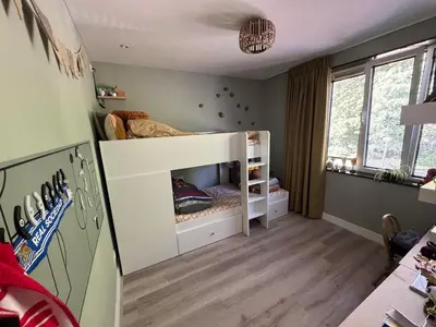 a small room with a bunk bed in a room at Family home Amsterdam Zuid - South in Amsterdam