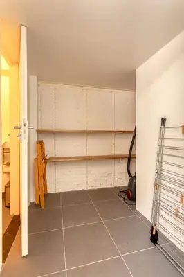 a room with white walls and a tiled floor at Voldersgracht Canal Home Haarlem in Haarlem
