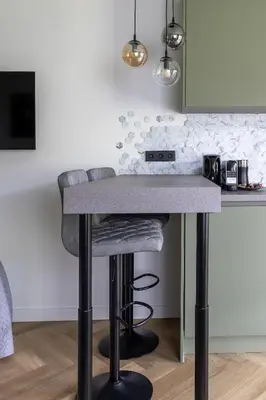 a kitchen with a counter with a bar stool at De Aanbouw van Foonloos - luxe studio vlakbij Utrecht in Houten