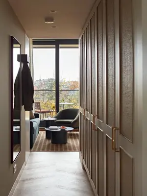 a hallway with a door leading to a living room at Numa Amsterdam Vondelpark in Amsterdam