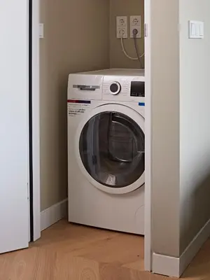 a washer and dryer sitting in a room at Numa Amsterdam Vondelpark in Amsterdam