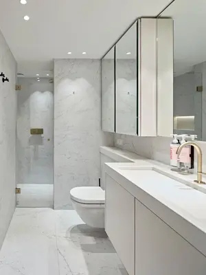 a white bathroom with a toilet and a sink at Numa Amsterdam Vondelpark in Amsterdam