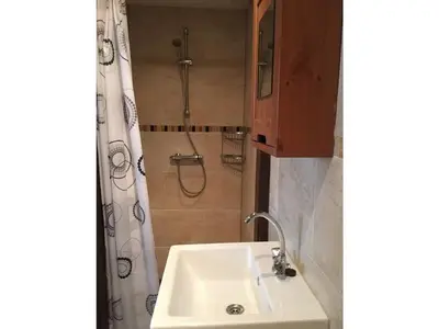 a bathroom with a sink and a shower at Apartment in Zandvoort with swimming pool in Zandvoort